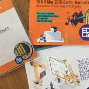 Ken Jones, author of this article, displays his conference pass, program and conference information