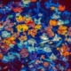 Different coloured leaves floating on water to represent autumn